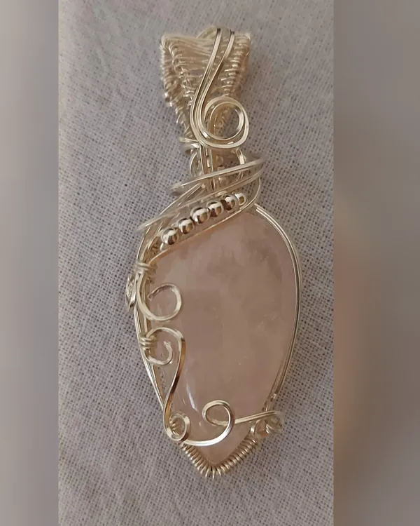 Blush, rose quartz pendant in silver-tone wire