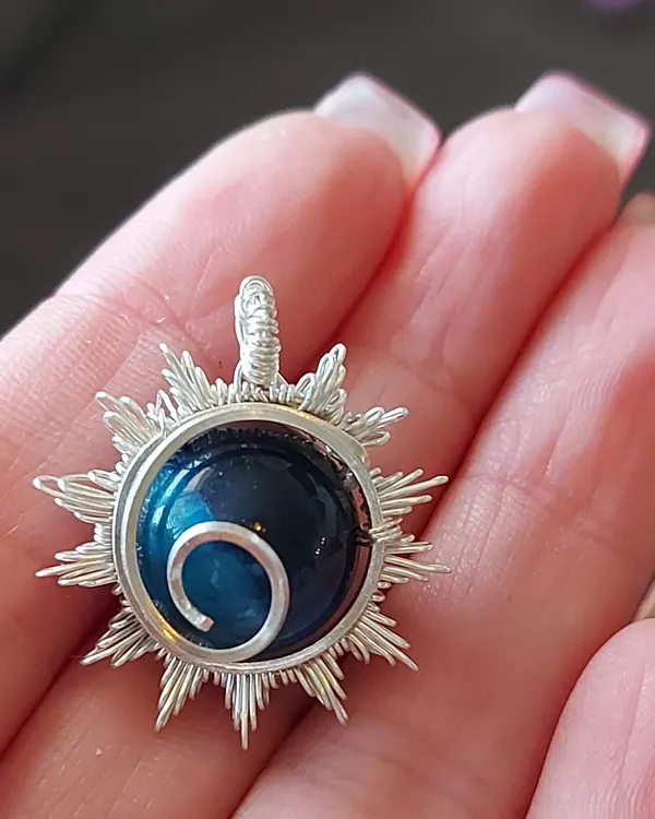 Midnight Sun, blue goldstone pendant in silver-tone wire