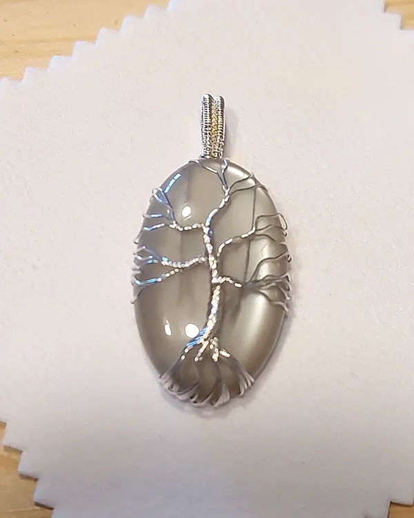 Tree of Life · Snow, clear quartz pendant in silver-tone wire